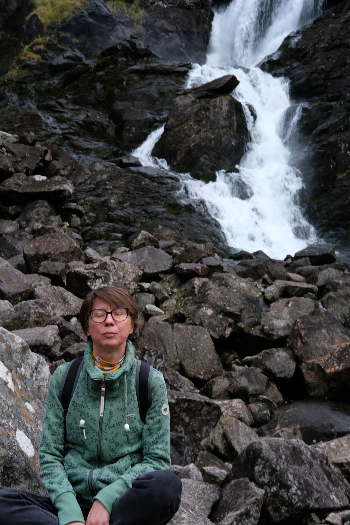 Ira meditating by the waterfall.