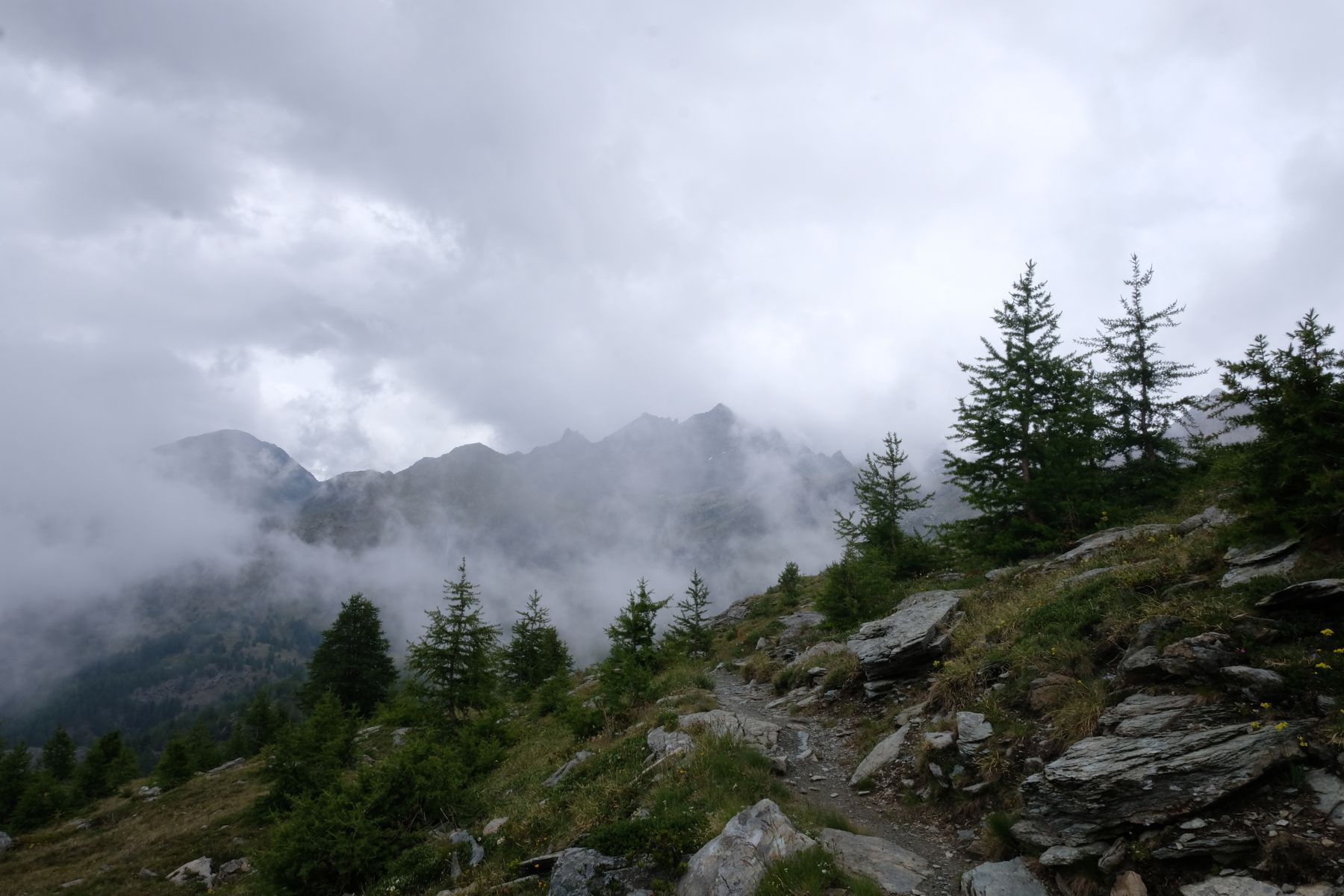 Clouds marching along the mountainside.