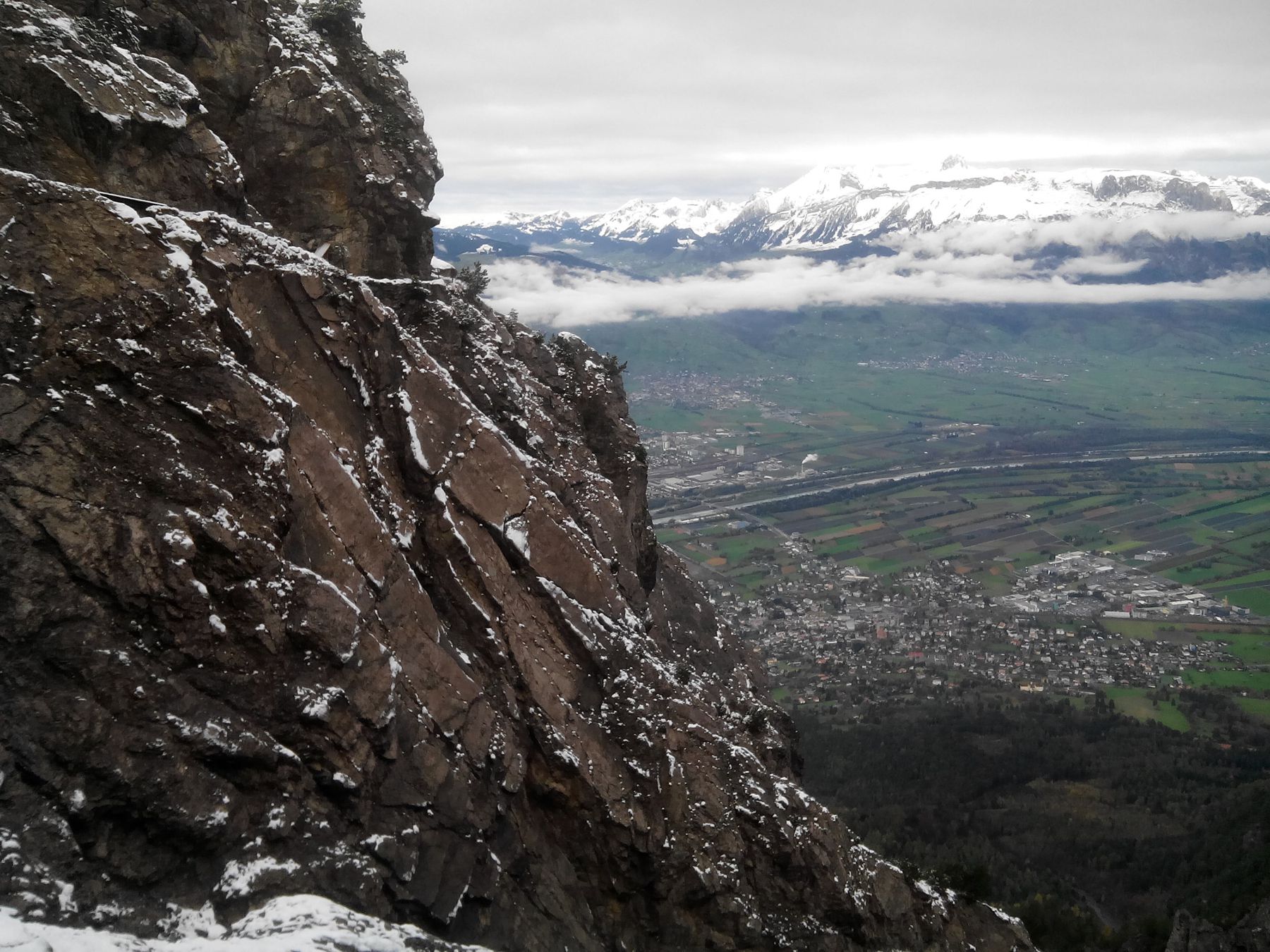 Mountainside with town far below